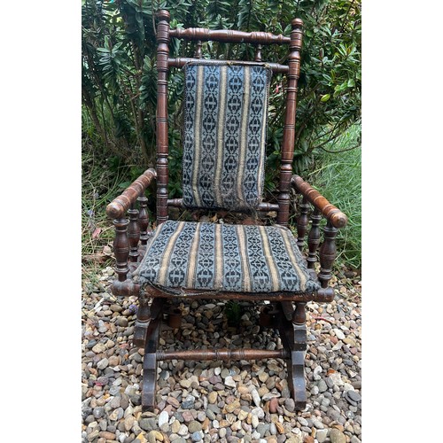 51 - A 19thC child's American rocker. Height to back 74cm, to seat 28cm, 41cm w.