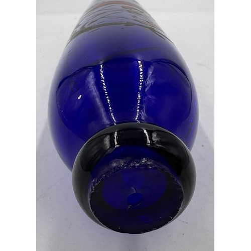 495 - A 19thC blue glass decorated rolling pin. 37cm l.