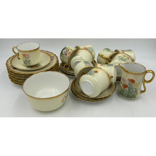 383 - Continental hand painted part tea service decorated with poppies and gilt edges to include 6 x plate... 