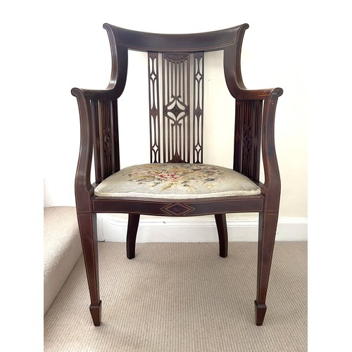 62 - An Edwardian mahogany inlaid armchair with wool work seat. 94.5cm h, to seat 44cm, width 57cm.