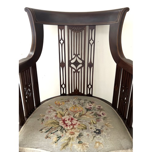 62 - An Edwardian mahogany inlaid armchair with wool work seat. 94.5cm h, to seat 44cm, width 57cm.