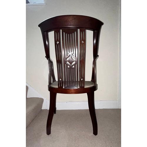 62 - An Edwardian mahogany inlaid armchair with wool work seat. 94.5cm h, to seat 44cm, width 57cm.