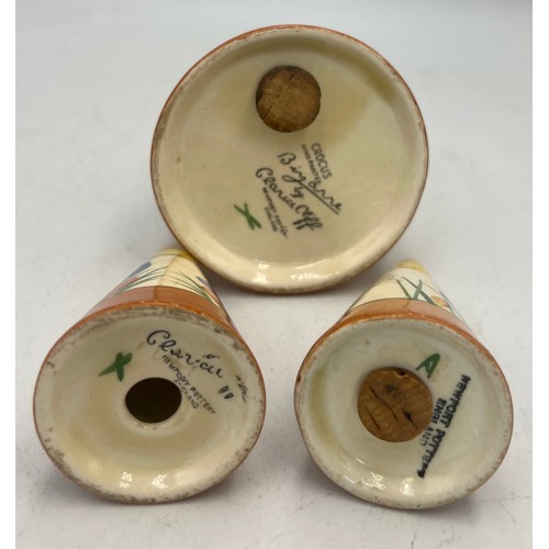 387 - A pair of Clarice Cliff Bizarre crocus pattern salt, pepper and sugar shaker, 14cm h.