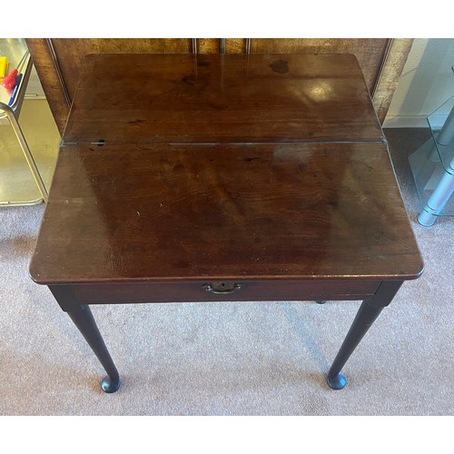 53 - An 18thC mahogany fold over tea table with single gate and pad feet. 76cm w x 36cm d x 72cm h.