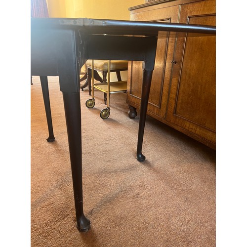 53 - An 18thC mahogany fold over tea table with single gate and pad feet. 76cm w x 36cm d x 72cm h.