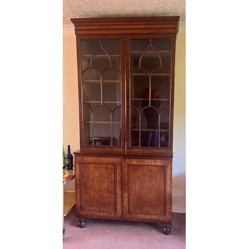 54 - Mahogany bookcase circa 1800 with glazed top and turned feet. 108cm w x 46cm d x 232cm h. The base w... 