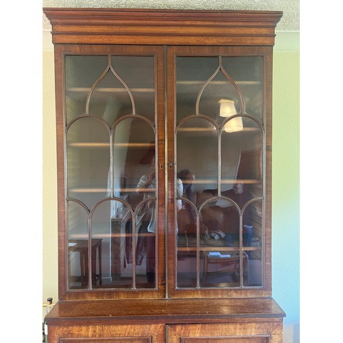 54 - Mahogany bookcase circa 1800 with glazed top and turned feet. 108cm w x 46cm d x 232cm h. The base w... 