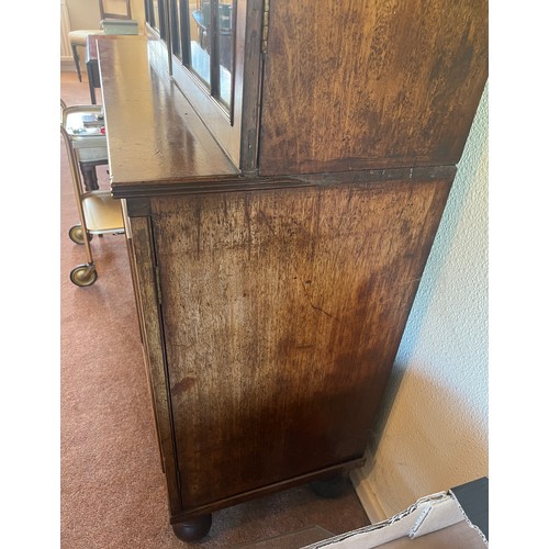 54 - Mahogany bookcase circa 1800 with glazed top and turned feet. 108cm w x 46cm d x 232cm h. The base w... 