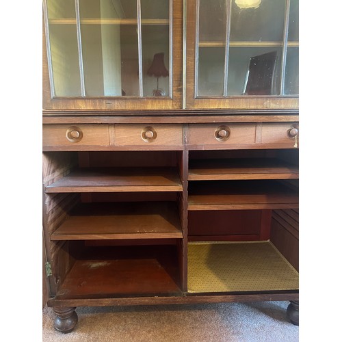 54 - Mahogany bookcase circa 1800 with glazed top and turned feet. 108cm w x 46cm d x 232cm h. The base w... 