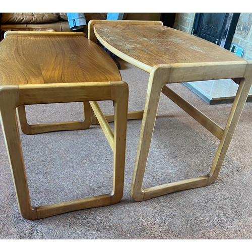 55 - Two mid 20thC teak nesting tables. 61cm w x 41cm d x 50cm h.