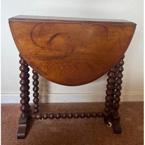 59 - A 19thC mahogany Sutherland table with bobbin turned supports on ceramic casters. 73cm open  x 57cm ... 