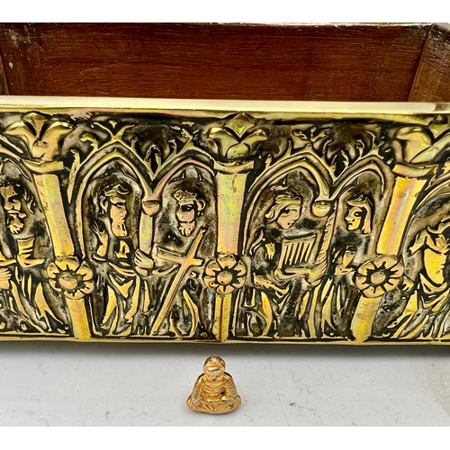 1071 - A brass wood lined casket depicting religious scenes. 15cm x 9 cm x 7cm h together with a tiny Buddh... 