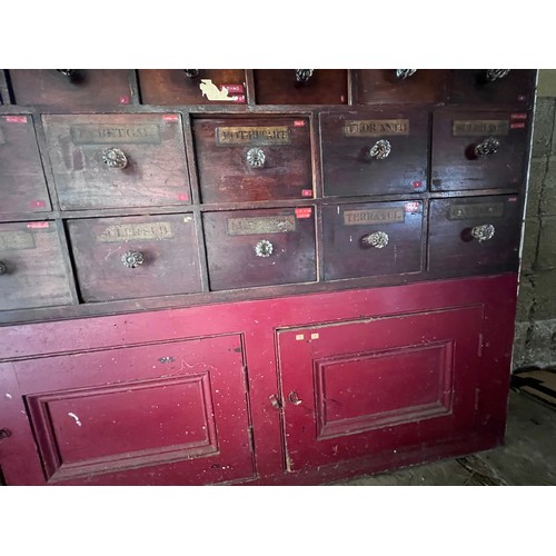 64 - Nineteenth century drug run/drawers, multiple drawers over cupboards to base. 268cm l x 137cm h x 30... 