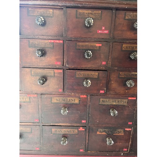 64 - Nineteenth century drug run/drawers, multiple drawers over cupboards to base. 268cm l x 137cm h x 30... 