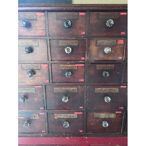 64 - Nineteenth century drug run/drawers, multiple drawers over cupboards to base. 268cm l x 137cm h x 30... 