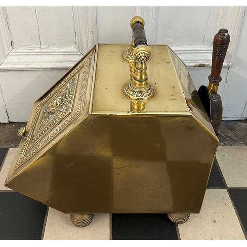 1072 - A 19thC decorative brass coal box with shovel  to rear. 42cm d x 28cm w.