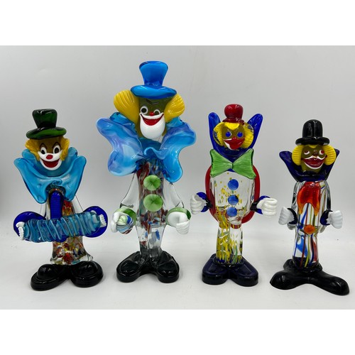 496 - Eight Murano glass clowns. Largest 31cm, smallest 21cm.