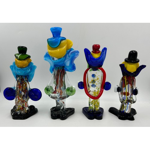 496 - Eight Murano glass clowns. Largest 31cm, smallest 21cm.