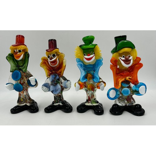 496 - Eight Murano glass clowns. Largest 31cm, smallest 21cm.