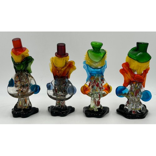 496 - Eight Murano glass clowns. Largest 31cm, smallest 21cm.