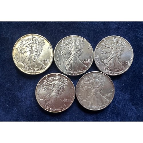 799 - A collection of five United States of America Silver Dollars to include 1986, 1987, 1989, 1991, 1992... 