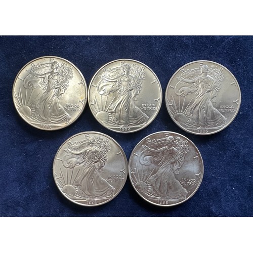 800 - A collection of five United States of America Silver Dollars to include 1993, 1994, 1995, 1998, 1999... 