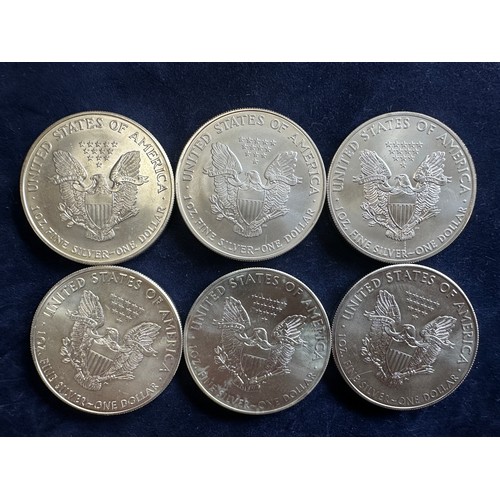 801 - A collection of six United States of America Silver Dollars to include 2002, 2006, 2014, 2016, 2017,... 