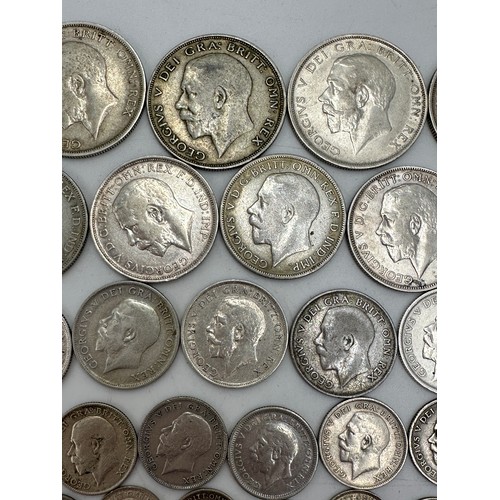 810 - A collection of mixed silver coinage to include George V : 6 x half crowns, 7 x florins, 10 x shilli... 