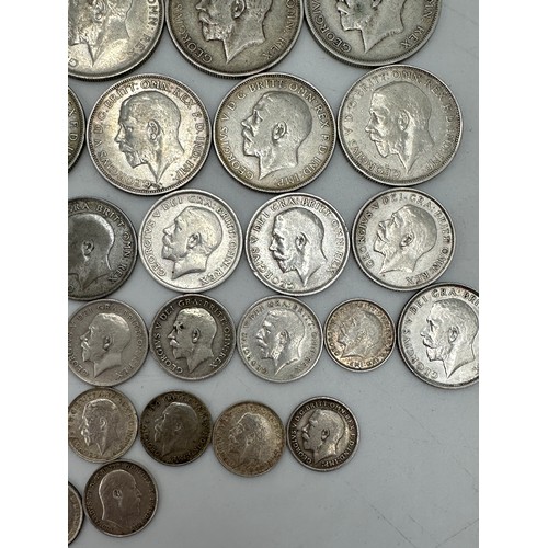 810 - A collection of mixed silver coinage to include George V : 6 x half crowns, 7 x florins, 10 x shilli... 