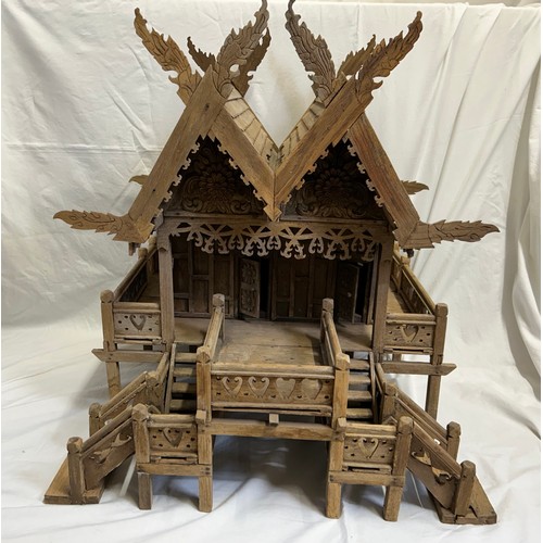 1372 - A vintage hand built wooden model of a Thai stilt house. 56cm h x 62cm x 60cm.