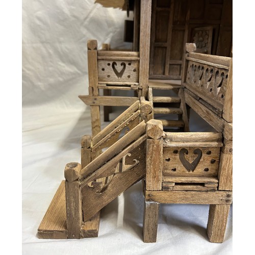 1372 - A vintage hand built wooden model of a Thai stilt house. 56cm h x 62cm x 60cm.