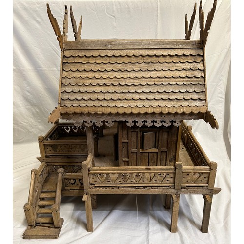 1372 - A vintage hand built wooden model of a Thai stilt house. 56cm h x 62cm x 60cm.