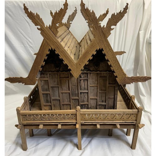 1372 - A vintage hand built wooden model of a Thai stilt house. 56cm h x 62cm x 60cm.