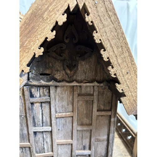 1372 - A vintage hand built wooden model of a Thai stilt house. 56cm h x 62cm x 60cm.