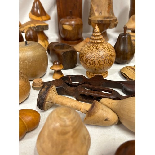 1373 - A collection of 20thC treen items to include toadstools, pears, apples, acorn, squirrel, hearts, lid... 