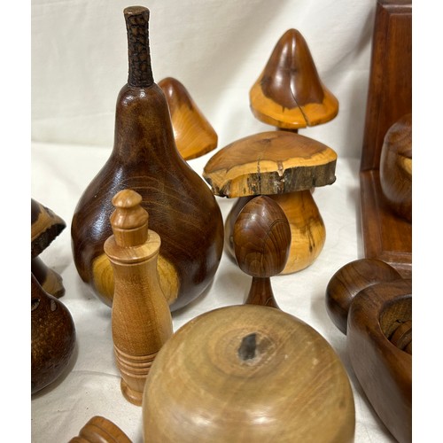 1373 - A collection of 20thC treen items to include toadstools, pears, apples, acorn, squirrel, hearts, lid... 