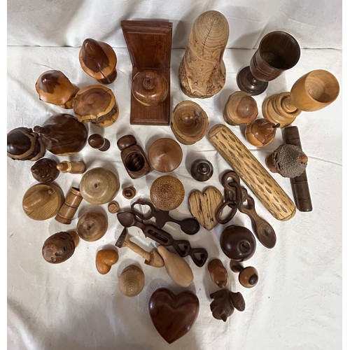 1373 - A collection of 20thC treen items to include toadstools, pears, apples, acorn, squirrel, hearts, lid... 