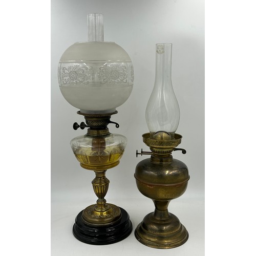 1130 - Two brass oil lamps. Lamp with shade approx. 60cm h.