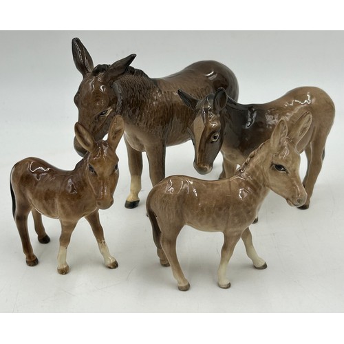 354 - Beswick. Four donkeys, tallest 14cm a Corgi, a cat and a Beatrix Potter Piglin Bland. (7)