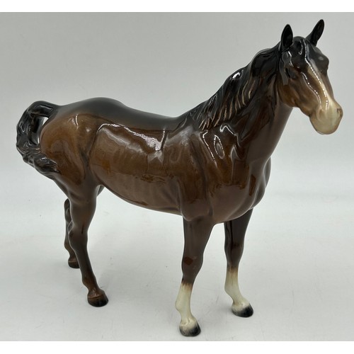 355 - A collection of Beswick horses and foals to include two Palominos. Tallest 21cm. (8)