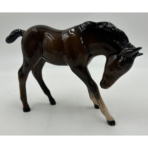 355 - A collection of Beswick horses and foals to include two Palominos. Tallest 21cm. (8)