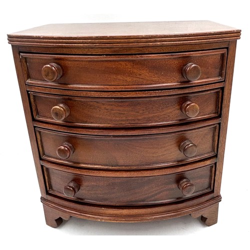 1066 - A miniature bow fronted mahogany jewellery chest with 4 drawers 23.5cm x 14cm to include an Italian ... 