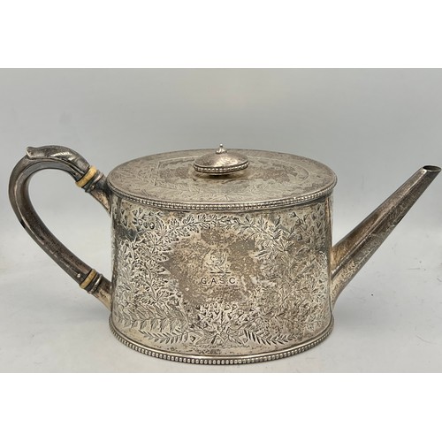 890 - A Victorian silver teapot, London 1883, maker Holland, Son & Slater.  Weight 638gm.