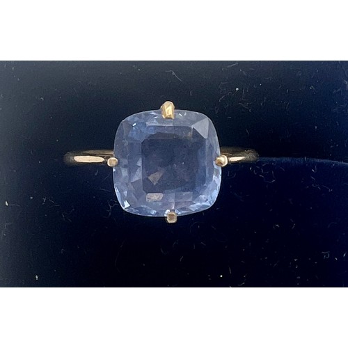 680 - An unmarked yellow metal ring set with sapphire. 5 carats. Size N. Weight 2.1gm.