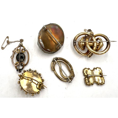 687 - Six 19thC brooches to include one containing hair and inscribed 1833.