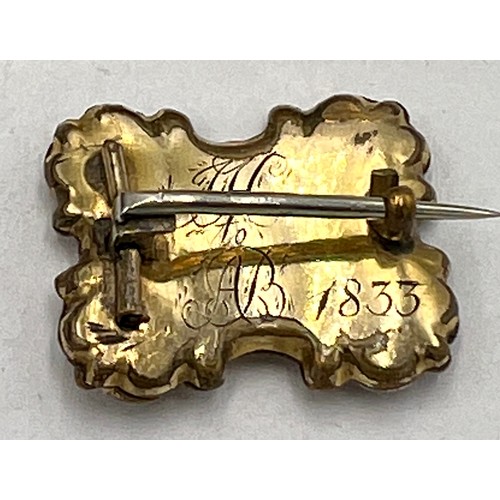 687 - Six 19thC brooches to include one containing hair and inscribed 1833.