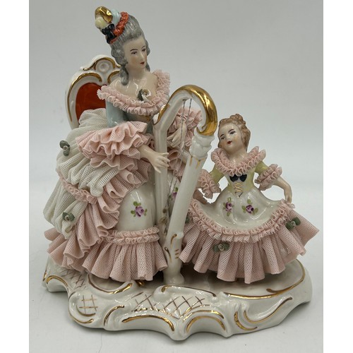 311 - Five early 20thC figurines to include a Dresden 'Mother & Child' with harp 18cm h with mark to base,... 