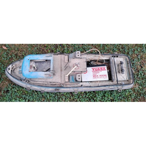 1294 - A vintage remote controlled boat. 34cm h x 76cm w x 27cm d.