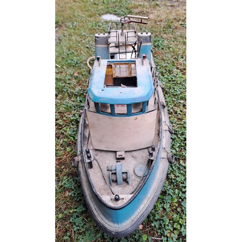 1294 - A vintage remote controlled boat. 34cm h x 76cm w x 27cm d.