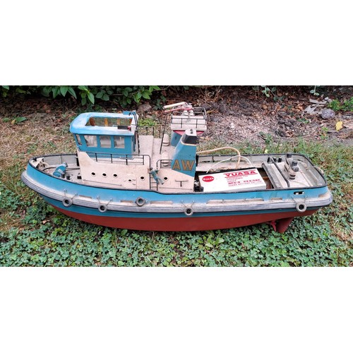 1294 - A vintage remote controlled boat. 34cm h x 76cm w x 27cm d.